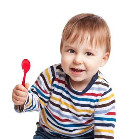 baby holding spoon royalty  stock images image