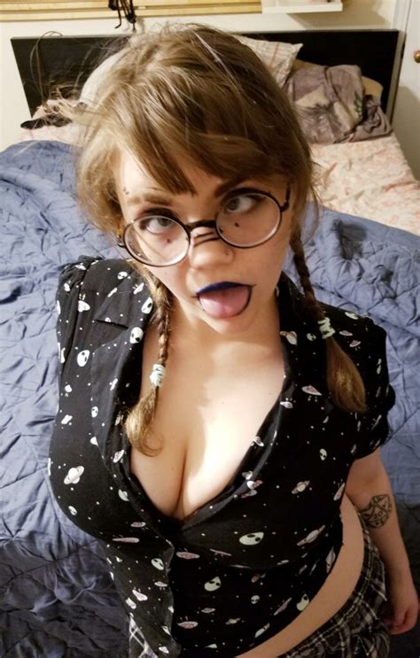 nerdy girl sticking out her tongue with glasses and dark makeup ahegao faces