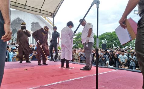indonesia carries out first ever caning of gay couple