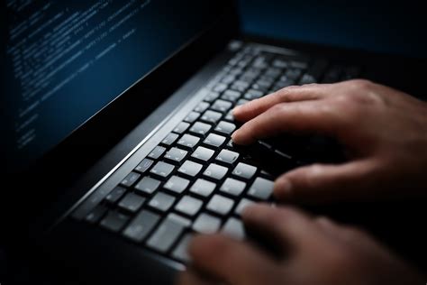 programmer  computer hacker typing  laptop keyboard empresa de
