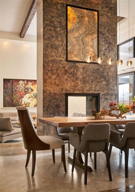 honeyonyx backlit fireplace separates  living  dining areas