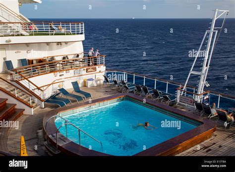 woman swimming  aft pool   emerald   seas cruise ship princess cruise  stock