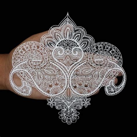 incricate paper cutting art pays homage  traditional paisley designs