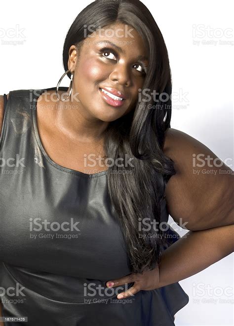 Plus Size Black Female Fashion Model Pose Against White