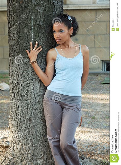 girl leaning on tree trunk stock image image of holding 5444659