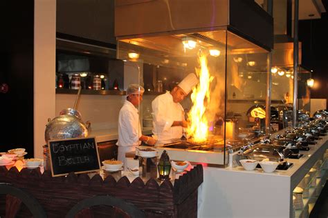 chefs  preparing food   kitchen  flames coming