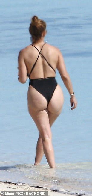 Jennifer Lopez Shows Off Her Famous Derriere In A Cheeky One Piece