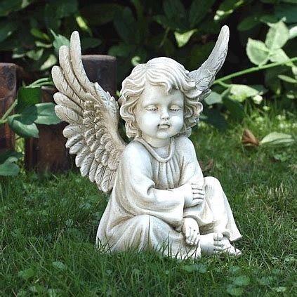 resting cherub sculpture