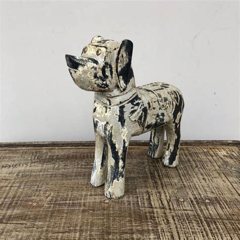 carved wooden dog nadeau dallas