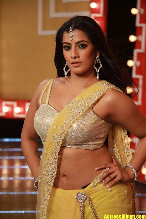 varalaxmi sarathkumar navel hip show photos from tamil movie in yellow