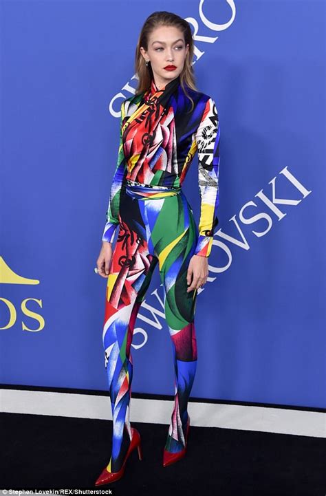 gigi hadid flaunts her flawless figure in skintight rainbow graphic bodysuit for cfda fashion