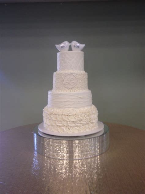 sweet 4 tier wedding cake in white buttercream a with