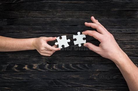 hands holding pieces  white puzzle stock photo image  creativity