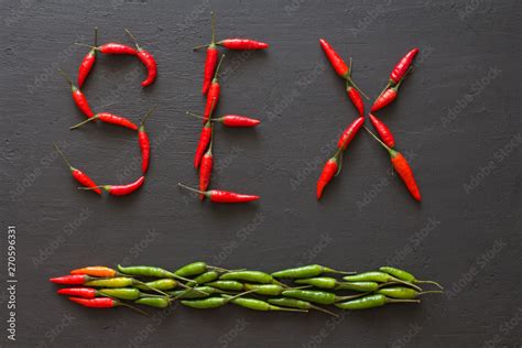 Word Sex Red Hot Chili Peppers On Black Background On Black Table Swx