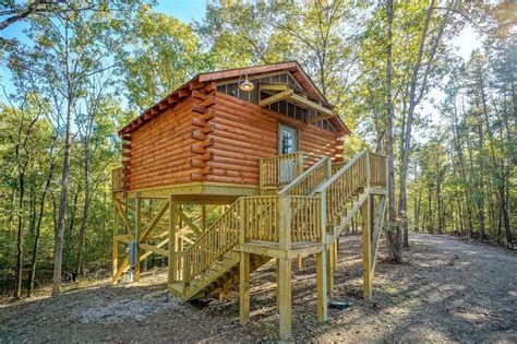whispering pines log cabin  stilts treehouse cabins tiny house vacation cabin  stilts