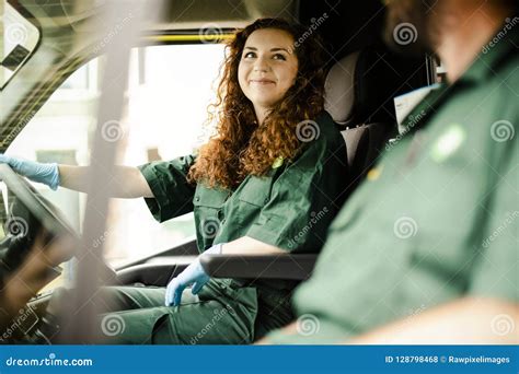 paramedic woman driving  ambulance stock photo image  emergency occupation