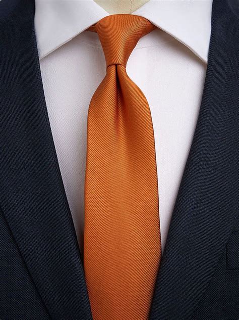 black suit orange tie ubicaciondepersonascdmxgobmx