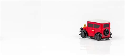 miniature toy red retro car on white background metal modela red toy