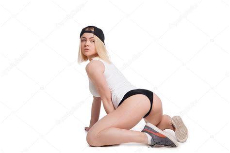 Female Model In Tank Top And Briefs Sitting On Her Knees