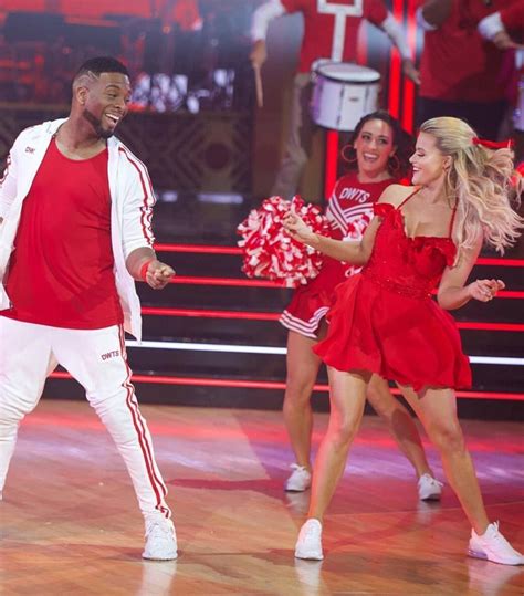 The Dancing Couple Is Dressed In Red And White For Their Performance On