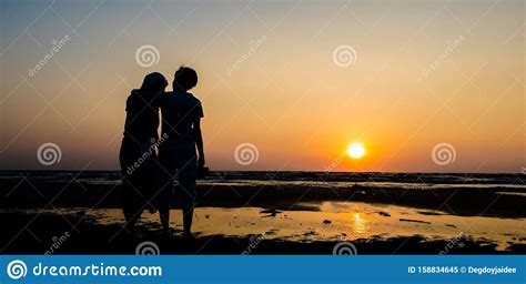 Asian Of Couple Lesbian Romantic Hugging On The Beach