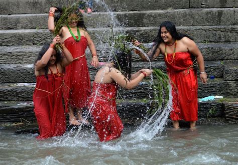 Nepalese Hindu Women Take A Ritual Bath In The Bagmati River During The