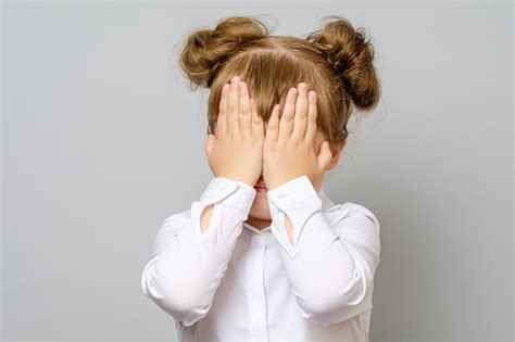 girl covering  eyes   hands isolated stock photo  image  istock