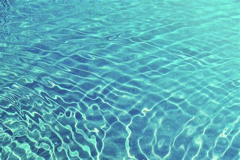 Ripples And Wave Patterns On Crystal Clear Blue Water