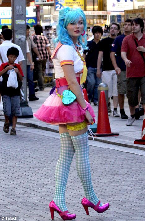 kirsten dunst plays japanese schoolgirl in blue wig and mismatched rainbow outfit daily mail