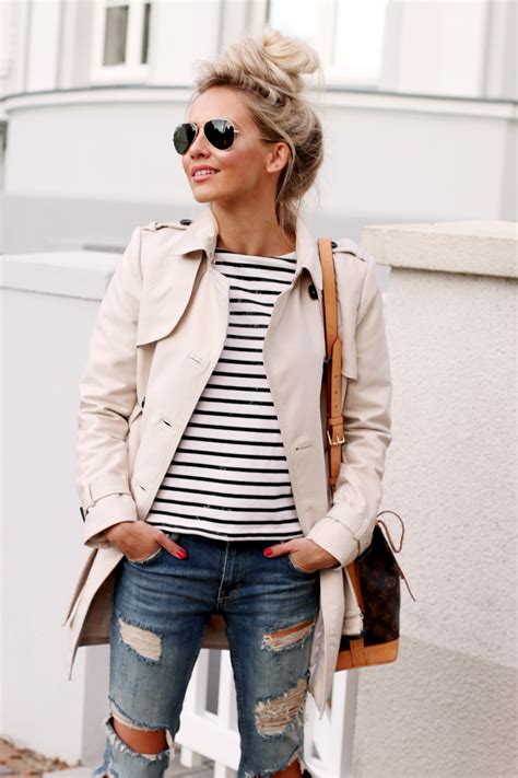 a classic trench coat striped shirt and ripped denim