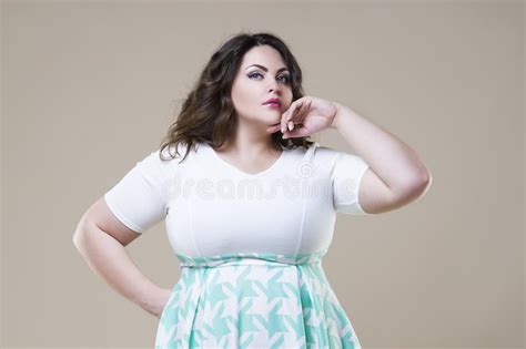 Plus Size Fashion Model Fat Woman On Beige Background Stock Image
