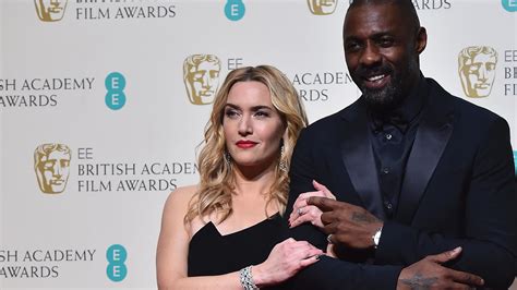 idris elba and kate winslet lock lips on set for upcoming