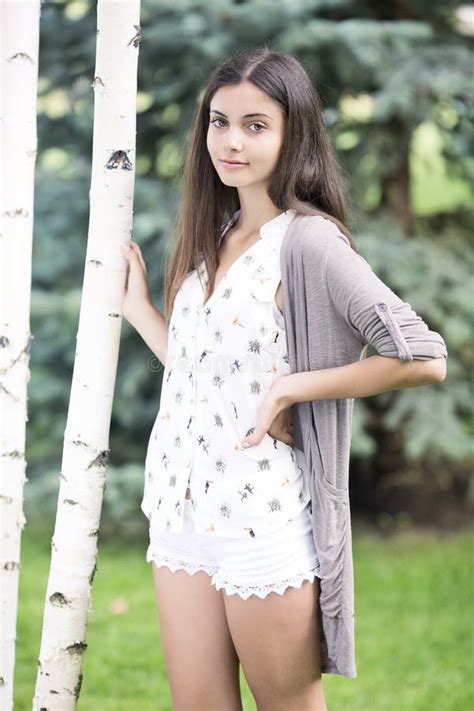 beautiful teen girl   park  green grass stock photo image