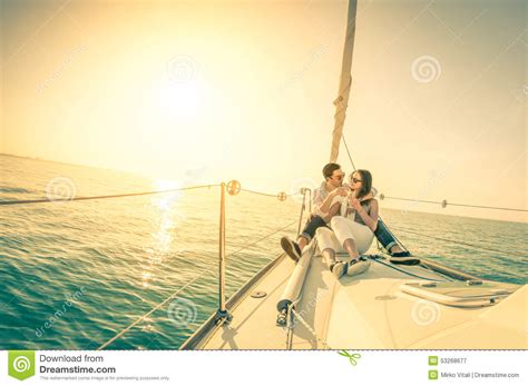 young couple  love  sail boat  champagne  sunset stock image image  beach girl