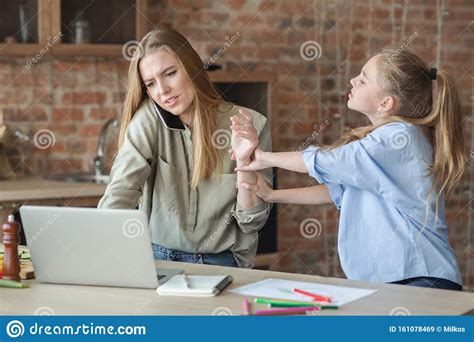Girl Asking Her Working Mom For Attention Stock Image Image Of