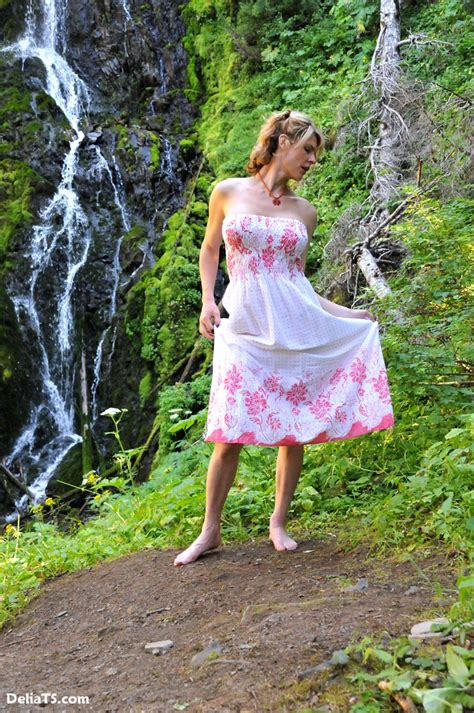 Pretty Delia Erect Under Dress By A Waterfall Photo 1