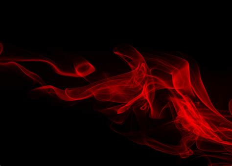 résumé de fumée rouge sur fond noir conception du feu photo premium