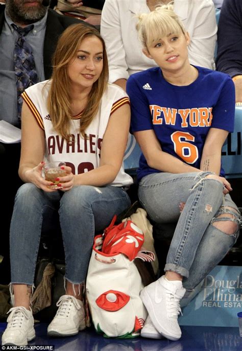 Miley Cyrus Takes The Spotlight At New York Knicks Game With Sister