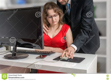 boss or manager is seducting his secretary in office harassment