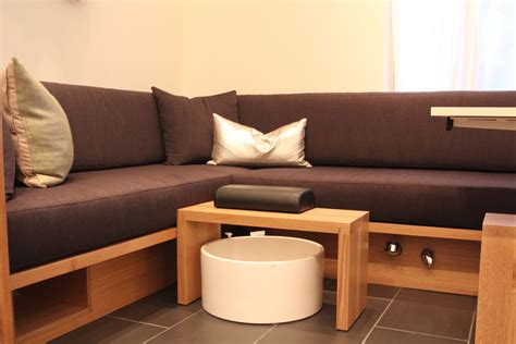 brown couch sitting  top   wooden floor    white coffee table