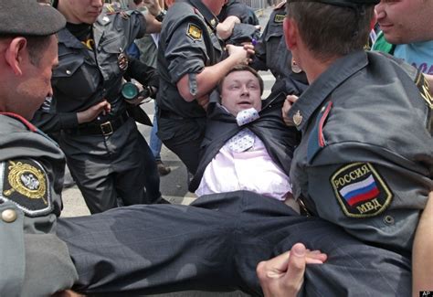russian police officers detain gay rights activist nikolai