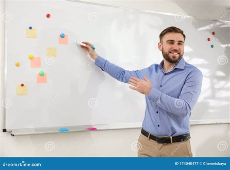 portrait  teacher writing  whiteboard  classroom stock image