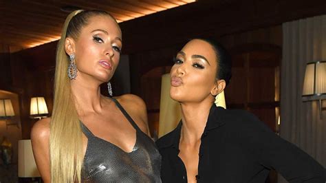 kim kardashian and paris hilton pose together as opposite twins
