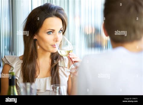 Portrait Of An Attractive Woman Drinking Wine While On A Date With Her