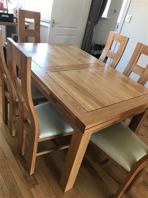 solid oak extending dining table   seater   chairs