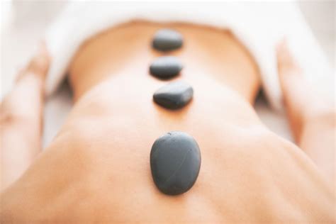 pure stone therapy which includes hot stone full body massage with