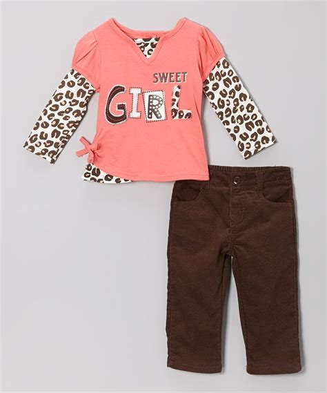look at this zulilyfind peach sweet girl top and black