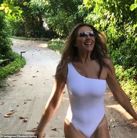 elizabeth hurley 53 sizzles as she slips into white swimsuit to