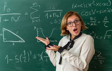 Free Photo Surprised Young Female Teacher Wearing Glasses Standing In