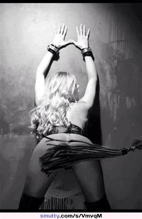 blackandwhite submissive bendover corset stockings blonde flogging cuffs leaningforward